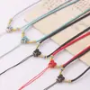 Cordón con colgante de nudo de hueso de durazno, cordón de collar de jadeíta tejido a mano, cordón para el cuello estilo étnico con hebilla de paz para DIY al por mayor