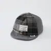 Al por mayor Otoño 2026 Lana Cálida Gorra de Pato para Bebé Estilo Coreano Serie a Cuadros para Niños y Niñas Sombrero de Ala Suave de Moda para Bebé