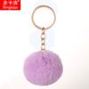 Llavero creativo de bola de pelo de color sólido con colgante de bola de pelo de conejo de imitación, flor pequeña colorida, adornos para bolsas de peluche, lote
