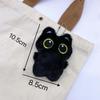 Nuevo gato negro de ojos grandes chirriante pequeño colgante muñeco de peluche lindo gatito negro bolsa chirriante venta al por mayor