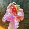 Nuevo llavero de biberón transfronterizo, exquisito colgante de arena líquida, accesorio de llavero para bolso, pequeño regalo, venta al por mayor de comercio exterior