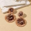 Aretes de isla hechos a mano de girasol de rafia y pasto, aretes de flores grandes exagerados de personalidad junto al mar, venta al por mayor de aretes