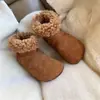 Versión de cuero suave 2026 nicho feo-lindo verde de moda botas de algodón personalizadas para mujer, cuero gamuzado, que aumentan la altura, forradas de felpa, botas de nieve estilo Birkenstock