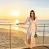 Vestido Estampado de Verão Novo Estilo Europeu e Americano Romântico Francês para Férias na Ilha com Decote V e Mangas Bufantes com Fenda