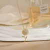 Colar para Mulheres, Flor de Zircônia Bauhinia Giratória da Moda Nicho Moda Novo Design Pingente Titânio Aço Colar de Temperamento