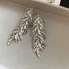 Pendientes geométricos florales de borla estilo metálico europeo y americano, pendientes de lujo ligero de alta gama, pendientes llamativos de moda y elaborados