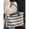Bolsa de palha simples de grande capacidade, bolsa de ombro feminina, nova bolsa tote listrada feminina de verão 2026 atacado