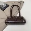 Bolso Retro Transfronterizo de Nicho para Motocicleta para Mujer 2026 Primavera Nueva Moda Bolso de Hombro con Remaches para Debajo del Brazo Bolso de Mano para Mujer