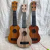 Ukelele para niños guitarra pequeña puede tocar grande, mediano y pequeño simulación niños y niñas Instrumentos musicales y juguetes para bebés al por mayor