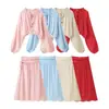 Atacado transfronteiriço 2026 Moda europeia casual solta renda amarração gola alta camisa + conjunto de saia curta feminino M6124