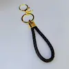 Chaveiro de corda trançada em couro PU com fecho de lagosta redondo para homens e mulheres, chaveiro de amor, cordão de mão para bolsa, atacado direto da fábrica