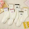Calcetines estilo coreano para mujer versátiles para las cuatro estaciones de largo medio hasta la pantorrilla estilo preppy Street Ins a cuadros a rayas casuales modernos calcetines para mujer