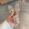Horquilla de mariposa de metal para mujer, accesorio para el cabello con borlas de medio lazo de temperamento de alto grado, nuevo clip para la cabeza en la parte posterior 2023