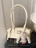 Bolso de Mujer Exquisito y de Moda 2026 Nuevo Invierno Simple Versátil Bolso de Hombro con un Toque de Lujo para Viajes de Negocios Transfronterizos