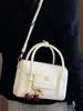 Shuai Mi Jia Bolso Pequeño Cuadrado Portátil Simple y Elegante Verano 2026 Nuevo Bolso de Hombro a la Moda Versión Coreana Bolso Cruzado de Nicho