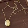 Collar con Colgante Metálico Ovalado de Acero de Titanio Nicho Personalizado Moda Cadena de Lana Ajustable Todo Fósforo Collar de Gama Alta para Mujeres