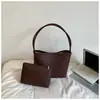 Bolso de axila texturizado vintage estilo francés para mujer, nuevo modelo 2026, bolso de hombro tejido versátil elegante casual moderno