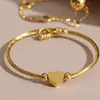 Pulsera Abierta Retorcible de Tubo de Alambre Suave con Forma de Corazón Geométrico Europeo y Americano Acero Inoxidable Chapado en Oro Real de 18K Joyería Versátil Transfronteriza