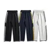 Nuevos Pantalones Casuales para Hombre 2026 para Otoño e Invierno, Marca de Moda de Punto Estilo Americano Pantalones de Pierna Ancha Curvos con Tres Rayas