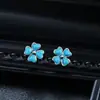 Pendientes de botón de trébol de cuatro hojas con gota de aceite transfronterizos europeos y americanos, aretes pequeños frescos versátiles de moda para hombre, accesorios de lujo ligero de alta gama para mujer