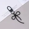 Nuevo Colgante de Hebilla de Puerta con Lazo Hueco Accesorios de Material DIY Llavero Hebilla de Puerta Hebilla Decorativa Mochila Colgante Pequeño