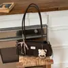 Bolsa de Axila de Nicho Transfronteiriça para Mulheres Nova Primavera 2026 Casual Vintage Bolsa de Ombro de Alto Valor Bolsa Baguete para o Dia a Dia