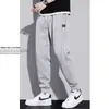 Calça de moletom masculina plus velvet grossa quente modeladora casual versátil moderna solta esportiva atacado