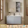 Tocador de baño engrosado y ahorrador de espacio con diseño en color crema, que cuenta con un lavabo redondeado, lavabo cerámico integrado y un lavabo de una sola pieza.