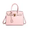 Bolsa de mão retrô de grande capacidade para mulheres, novo estilo 2026, bolsa de platina transfronteiriça da moda, adequada para o trabalho e uso casual, bolsa Kelly transversal