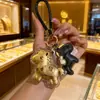 Nuevo Estilo Llavero "Caballo de Dinero" con Dorado, Llavero de Coche, Colgante para Bolso, Regalo del Año del Caballo