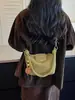 A bolsa de dumpling trançada popular deste ano para mulheres é a nova bolsa de ombro simples da moda de 2026, uma bolsa transversal de nicho estilo coreano