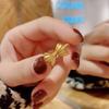 Anillo de lazo de oro arena de Vietnam para mujer anillo retorcido vivo moda simple simple explosión suministro venta al por mayor