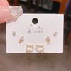Verano nuevo chapado en oro real exquisitos tres pares de aretes pequeños de alto sentido pequeños frescos dulces aretes de temperamento combinables