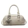 Bolsa tote de textura nicho estilo bowling feminina 2026 nova retrô versátil de ombro único bolsa almofada de axila bolsa transversal casual