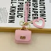 Mini bolsa de presente simples pode guardar fones de ouvido e chaveiros, bolsa de fone de ouvido de cor sólida, pingente de couro, bolsa quadrada criativa, bolsa longa