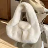 Bolso de mujer elegante de alta gama 2026 nuevo de moda versátil de felpa de mano de un solo hombro moda retro bolso cubo