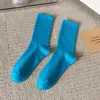 Calcetines coloridos para mujer en línea rojos súper calientes calcetines de canalé verano finos de longitud media pantimedias de moda ins color caramelo medias japonesas