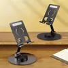Soporte Plegable de Metal para Teléfono Giratorio 360° | Soporte de Escritorio Ajustable con Silicona Antideslizante, Puerto de Carga y Eje Duradero