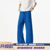 Calça masculina azul de perna larga, corte solto, com estampa de escamas de cobra, marca tendência CL Klein ean2026, levemente flare, verão