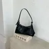 Bolso bandolera de media luna de alta calidad vintage 2026 nuevo moderno simple versátil para el trabajo y el trayecto al trabajo bolso de hombro para debajo del brazo para mujer