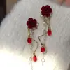 Pendientes de Rosa Gota de Agua Estilo Francés Retro Super Hada Rosa Terciopelo Rojo 2026 Pendientes Largos de Borla de Gama Alta para Mujer