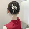 Pinza para el pelo de verano 2025 con borla de mariposa, aleación electrochapada, accesorio para el pelo de perla, pasador retro de nuevo estilo chino para mujer