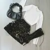 Comércio Exterior Transfronteiriço primavera 2026 saia midi feminina sexy evasê estilo europeu e americano cintura alta colada ao corpo minissaia curta com lantejoulas