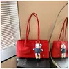 Bolso tote retro de nicho coreano para mujer, nuevo diseño simple esmerilado con colgante, sensación casual y de alta gama, bolso tote de un solo hombro