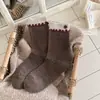 Botão de acessório de acabamento de orelha de madeira meias de botão meias femininas de cano médio Outono Inverno Meia folgada estilo garota japonesa ins sem costura