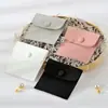 Stock Listo de Fábrica Venta al por Mayor Portátil Viaje Almacenamiento Botón de Presión Microfibra Terciopelo Bolsa Anillo Collar Pulsera Almacenamiento Bolsa de Embalaje