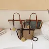 Bolsa de Gran Capacidad Estilo Coreano Transfronteriza para Mujer Verano 2026 Nuevo Bolso Tejido Pequeño de Nicho Bolso Cubo de Moda Elegante para Vacaciones