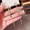 Nuevos aretes largos de borla de mariposa estilo coreano, de alta gama, para mujer, temperamento moderno, diseño nicho, aretes de alta calidad