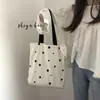 En stock Bolsa de Lona de Dibujos Animados para Llevar en la Mano un Solo Hombro Estudiante Tutores Literatura Versátil Cuatro Estaciones Portátil Bolsa de Tela Bolsa de Viaje para Mujer