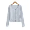 Conjunto de três peças estilo francês: camiseta de manga longa com cardigã de desejo puro + top tipo camisola + saia evasê de cintura alta elástica